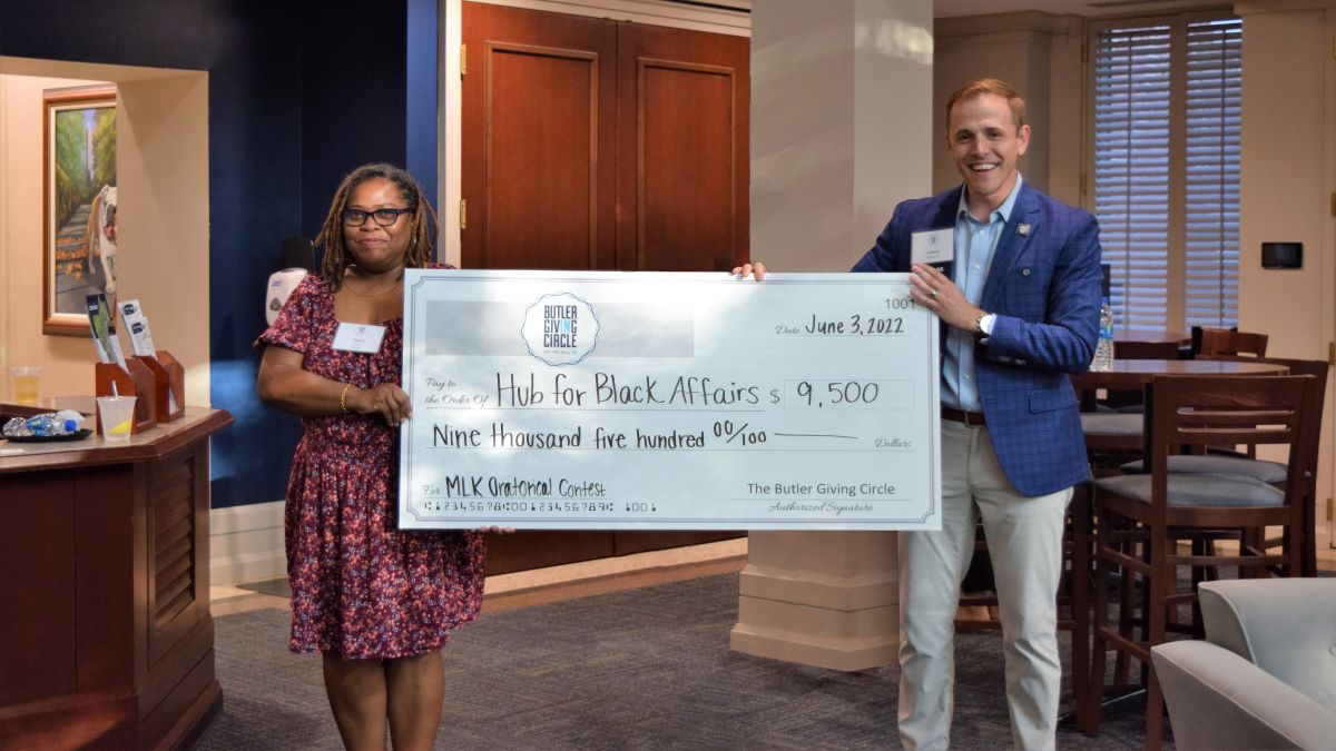 Image from Terri Jett and Loren Snyder holding check for MLK Oratorical Contest article